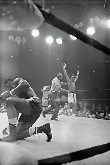 Boxer Muhammad Ali Defeating Boxer Sonny Liston