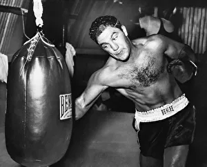 Rocky Marciano Practices on Punching Bag Print, Art Prints