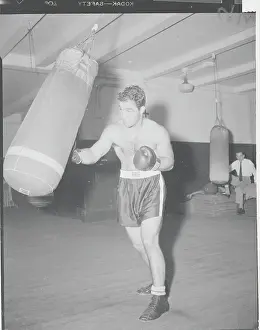Boxing Champion Rocky Marciano Training with Boxing Bag