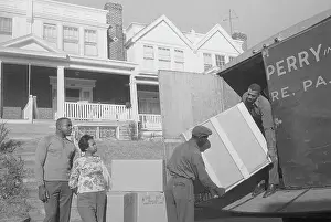 Boxing Through the Ages: A Stunning Visual Journal: Boxing Champion Sonny Liston and Wife Guiding Movers at Van