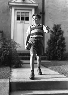 10 11 Years Prints: Boy (10-11) on way to school, (B&W)