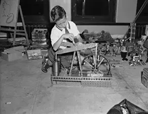 6 7 Years Prints: Boy (6-7) playing with building blocks
