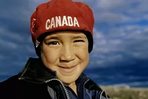 Western Script Gallery: Boy (7-9) smiling, wearing Canada hat, close-up, portrait