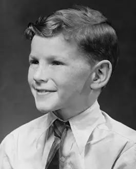 Shirt And Tie Prints: Boy (8-9) smiling, posing in studio, (B&W)