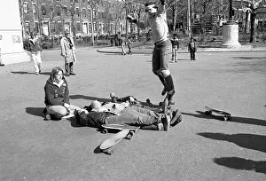 Up And Down Prints: Boy Attempting Jump over Bodies onto Skateboard