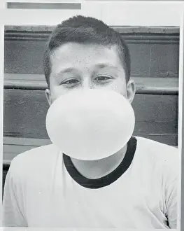 Boy Blowing a Bubble Gum Bubble
