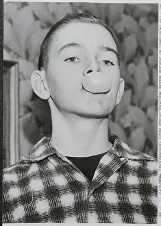 Boy Blowing a Bubble Gum Bubble