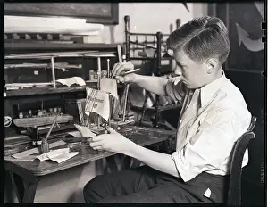 Boy Building a Model Ship