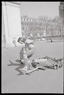 Up And Down Prints: Boy Completing Jump over Bodies onto Skateboard