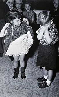 San Jose Prints: Boy Covering Eyes as Girl Raises Skirt