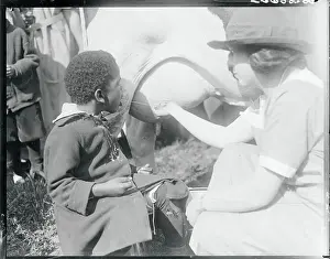 Boy Drinking from Cow Utter
