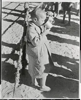 Boy Drinking From a Cup
