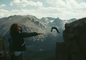Huty31503 Prints: Boy Feeding Bird In Rocky Mountains