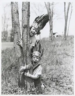 Boy and Girl Playing Indians Outdoors