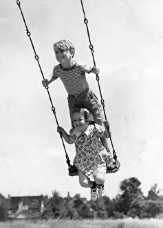 Success Gallery: Boy And Girl On Swing