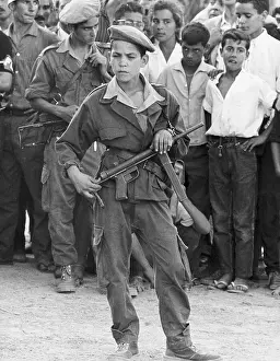 Algiers Prints: Boy with Gun Stands Alone Before Other Boys