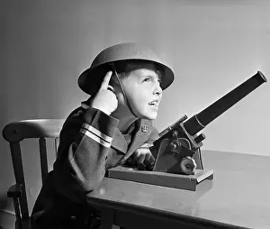 Missile Prints: Boy with Helmet Operating Toy Missile Gun