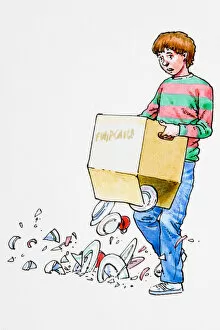 Boy holding box, contents dropping onto floor