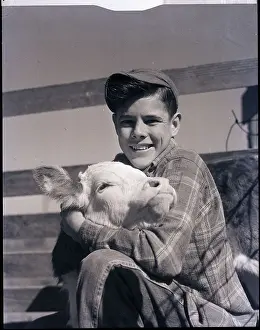 Calf Prints: Boy Holding Calf