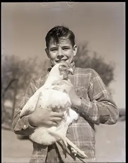 Teenage Boy Prints: Boy Holding Chicken