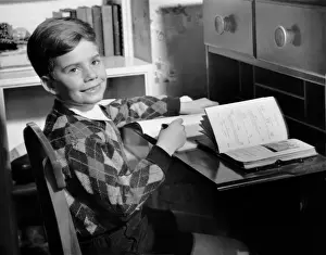 Boy indoor at desk