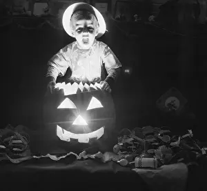 Boy with Jack-o-Lantern on Halloween