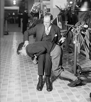 Boy Over Knee Of Mechanical Spanker
