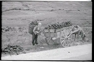 County Kerry Prints: Boy Loading Peat into Wagon