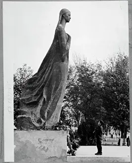 Uzbekistan Prints: Boy Looks up at Statue of Nurkhon Yuldasheva