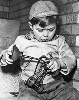 Boy oiling roller skates