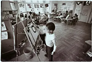 Boy Paints in Kindergarten Class
