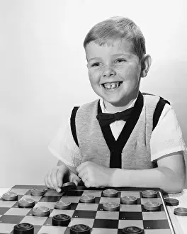 Checkers Prints: Boy playing checkers