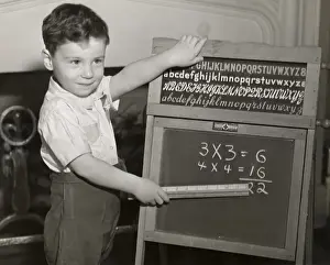 Boy playing school
