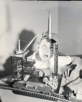 Outer Space Prints: Boy Playing With Space Age Rocket Toys
