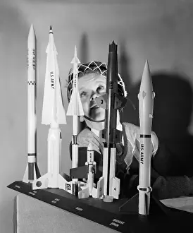 Boy Playing With Space Age Rocket Toys