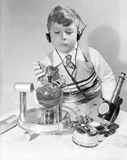 Radioactivity Prints: Boy Playing with Toy Atomic Laboratory