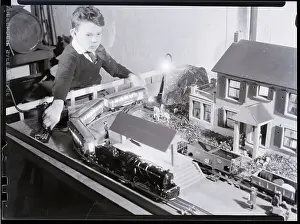 Trains Prints: Boy Playing with Train Set