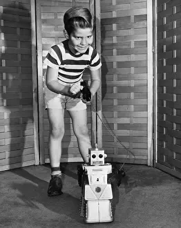 Boy With Remote Control Robot