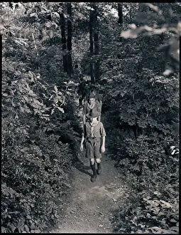 Trail Prints: Boy Scouts Hiking Through the Woods