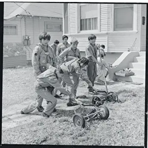 Boy Scouts Mowing a Lawn