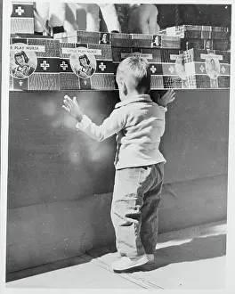Boy Searching a Toy Counter