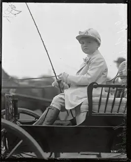 Outfit Prints: Boy Seated In Cart In Riding Gear