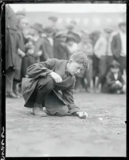 Boy Shooting Marbles