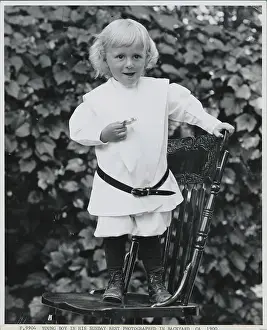 Boy Standing on Chair