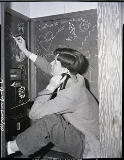 Everyday Scene Prints: Boy in Telephone Booth Doodling on Blackboard