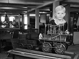 Boy with Toy Locomotive