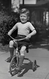 Boy on tricycle