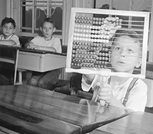 Convenience Prints: Boy Using Abacus in Class