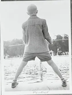 Boy Viewing Model Sail Boats