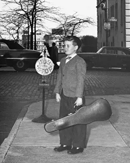Boy waiting at bus stop
